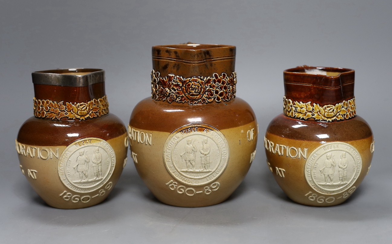 National Rifle Association, salt glazed stoneware, three jugs and four tumblers, 1860-1889, tallest 17cm